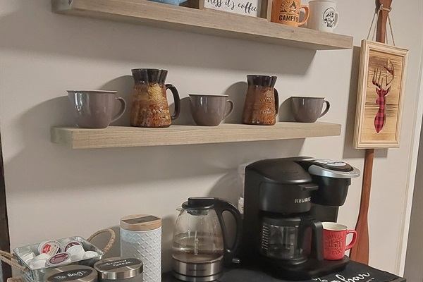 Start your mornings your way—coffee corner stocked with K-cups, ground coffee, tea bags, hot chocolate, and sugar.