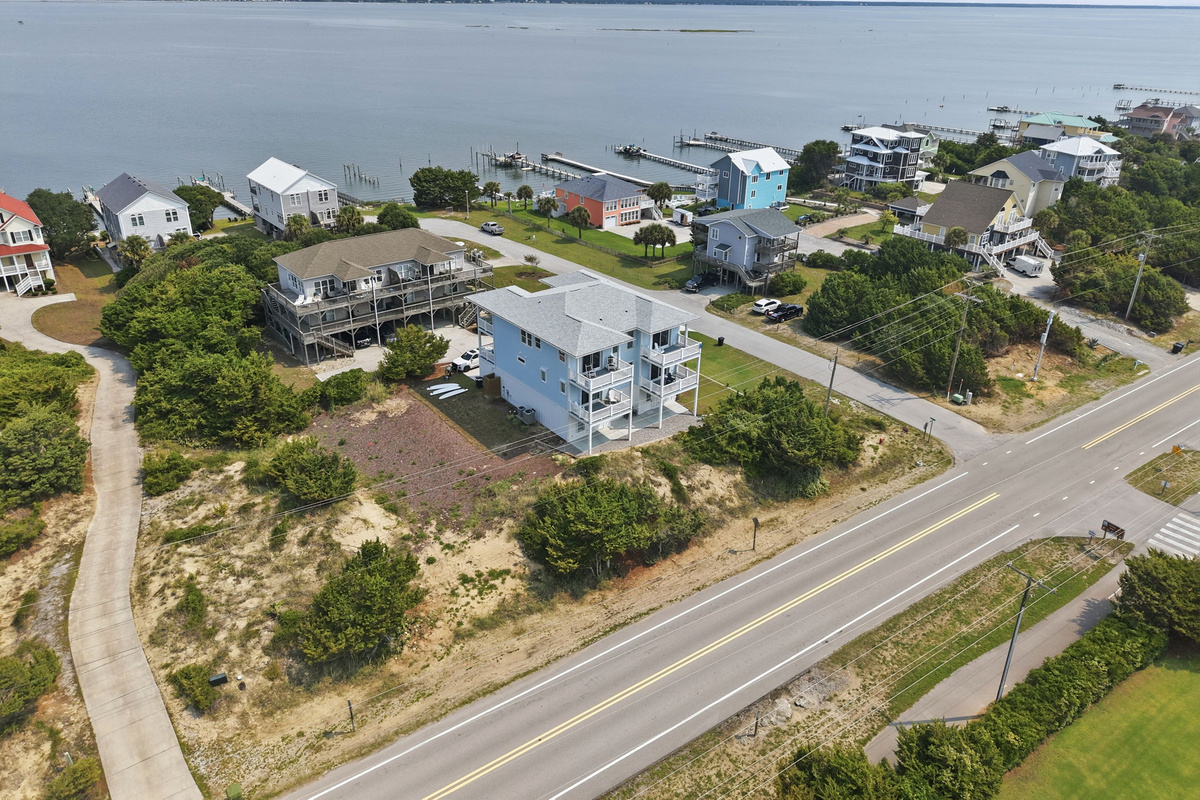 Aerial view capturing both the sound and ocean sides, giving guests a clear picture of the home&rsquo;s unique location near the water