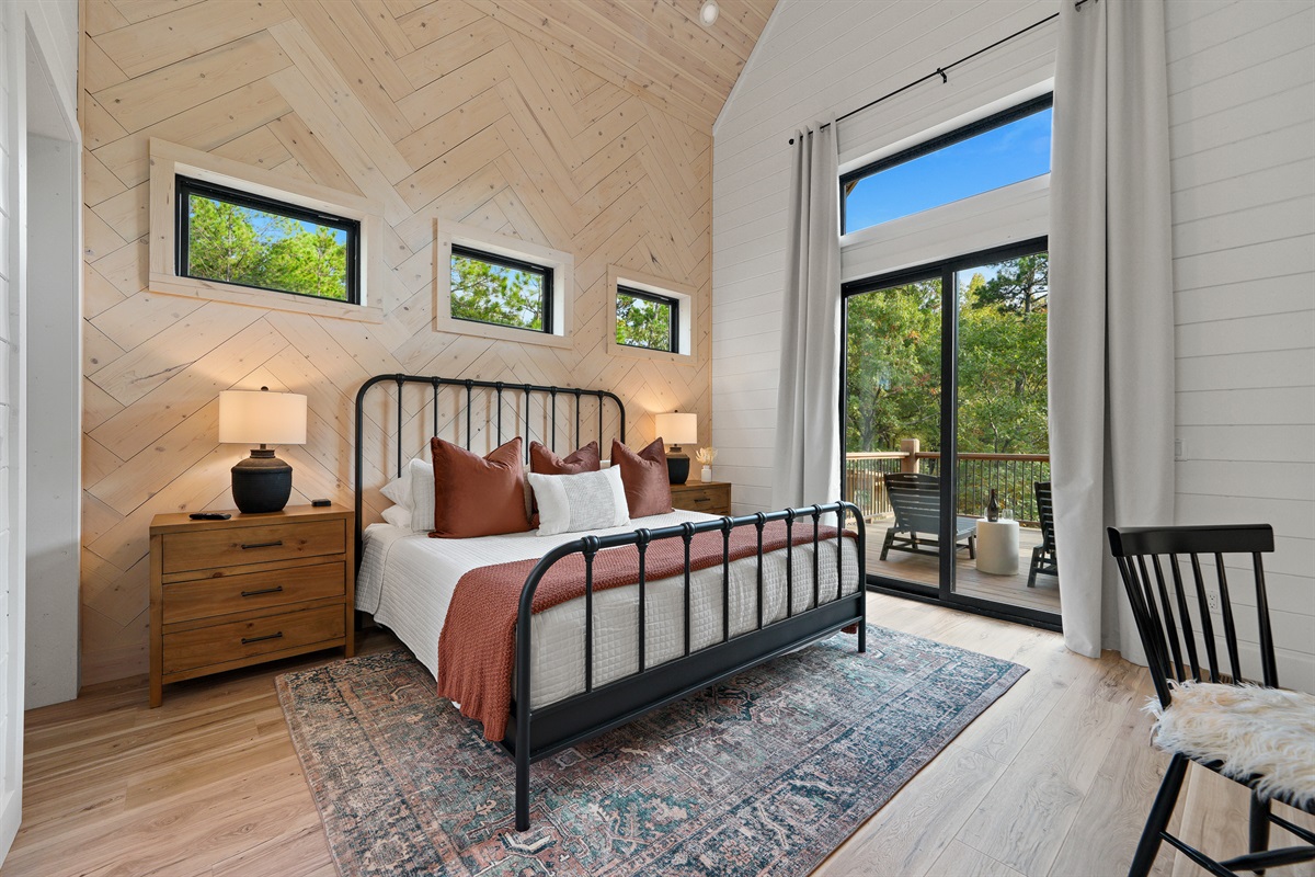 Bedroom suite #2 has king size bed and private access to deck area with two chaise loungers