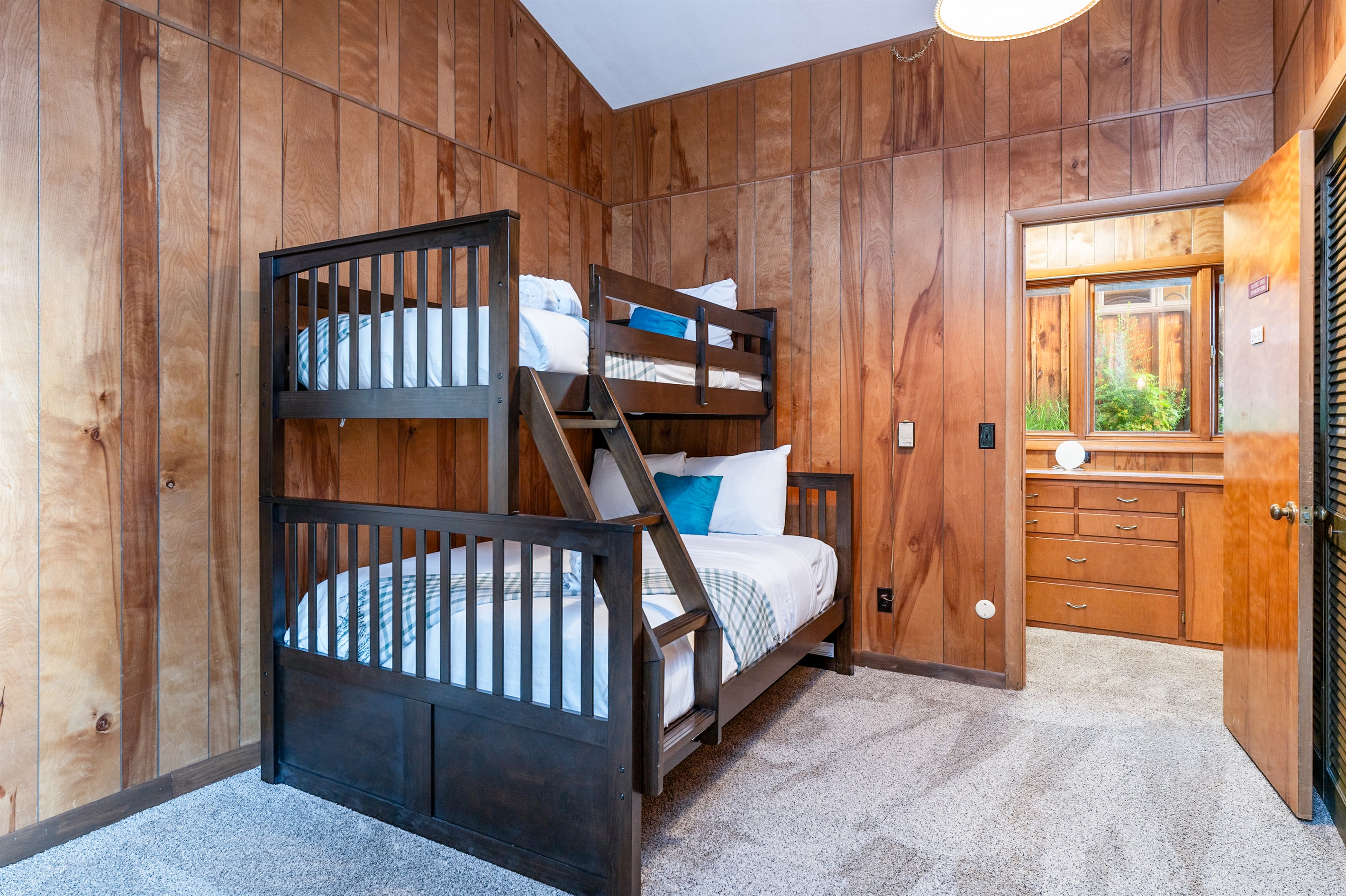 Spacious bunk room featuring a twin-over-full bunk bed, ideal for families or friends traveling together.
