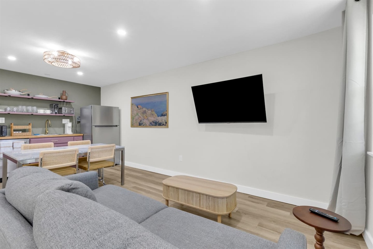 Experience this large 500 sq ft studio with an open layout, king bed, full kitchen, and cozy lounge area for relaxing or streaming your favorite shows.
