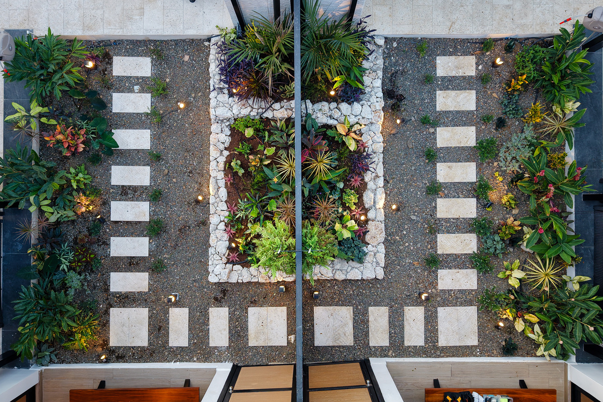 Aerial view — mirrored garden pathways between the twin villas.