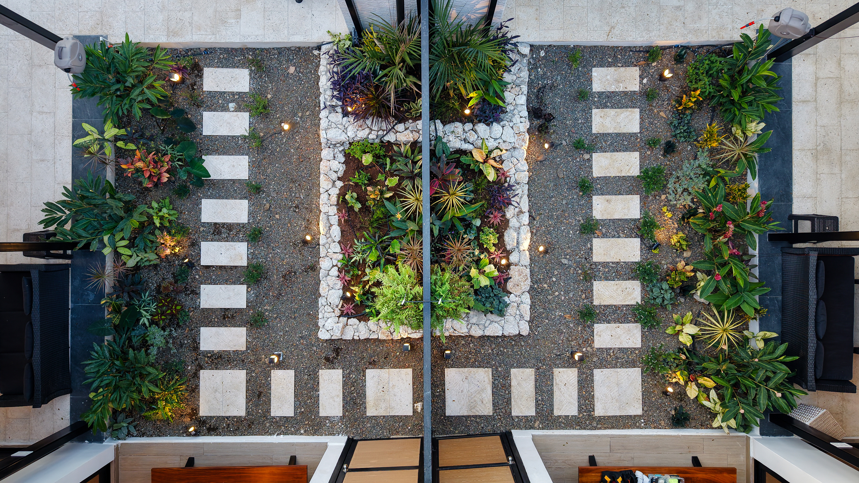 Aerial view — mirrored garden pathways between the twin villas.