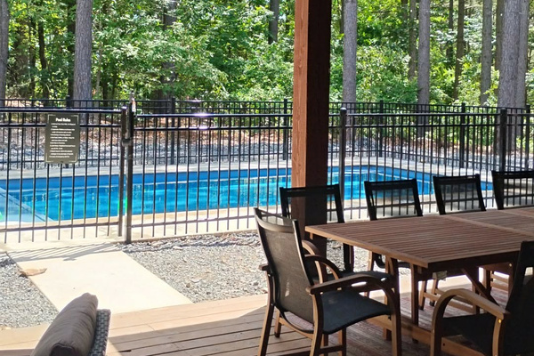 Newly completed 14' x 29' heated pool, open year round and designed for relaxation and fun. Surrounded by towering pines, the pool ranges from approximately 3 feet to 6 feet deep, making it perfect for both lounging and swimming.