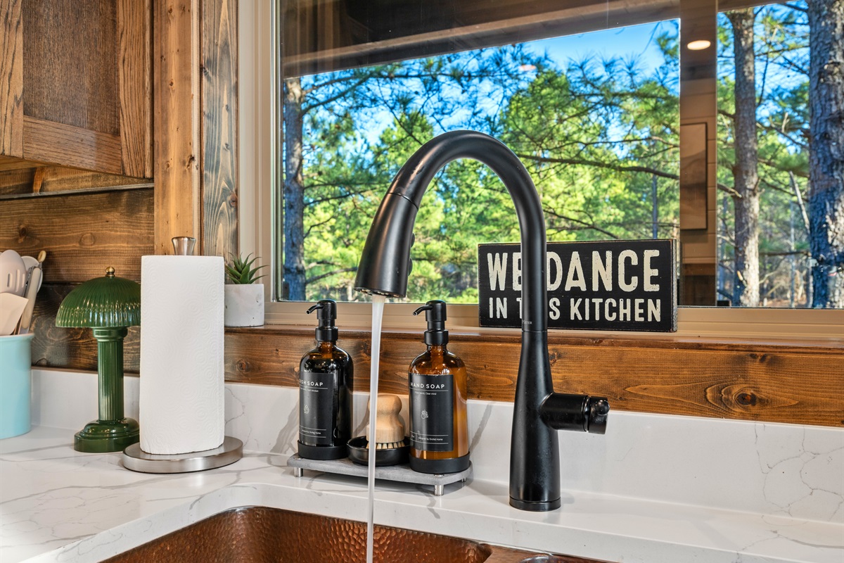 Rinsing dishes doesn’t feel like a chore when you’ve got a bright window view, a deep sink, and a kitchen that feels open and cheerful.