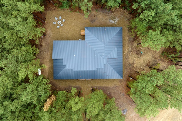 Nestled under beautiful tall pines. 