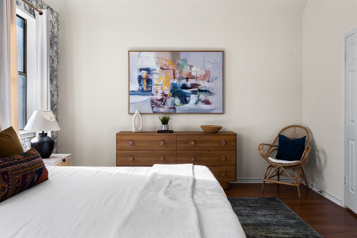 A snug corner in the main bedroom with a comfy lounge chair for relaxation.