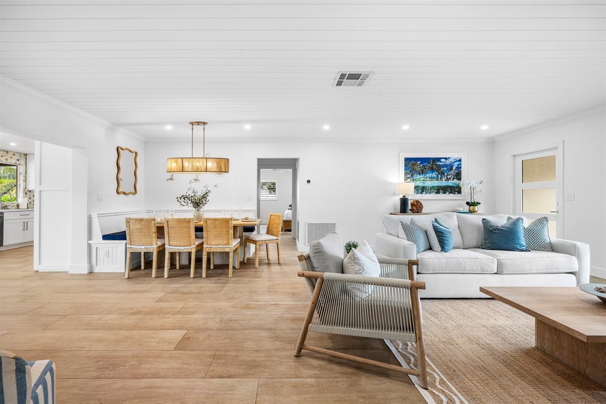 Gather in style around the elegant dining area, perfectly positioned for seamless flow between indoor lounging and breezy outdoor moments.