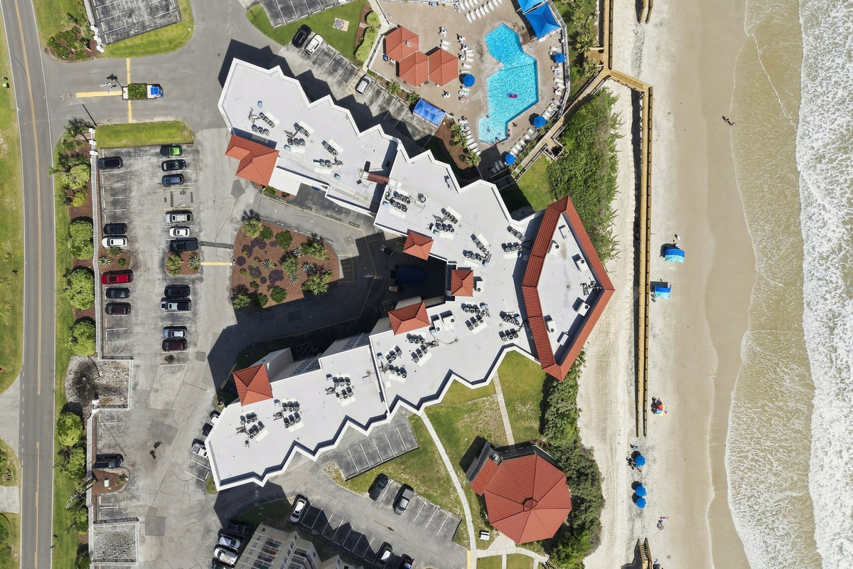 A full overhead view of the resort layout, showing the easy flow from your room to the pool and straight out to the beach.