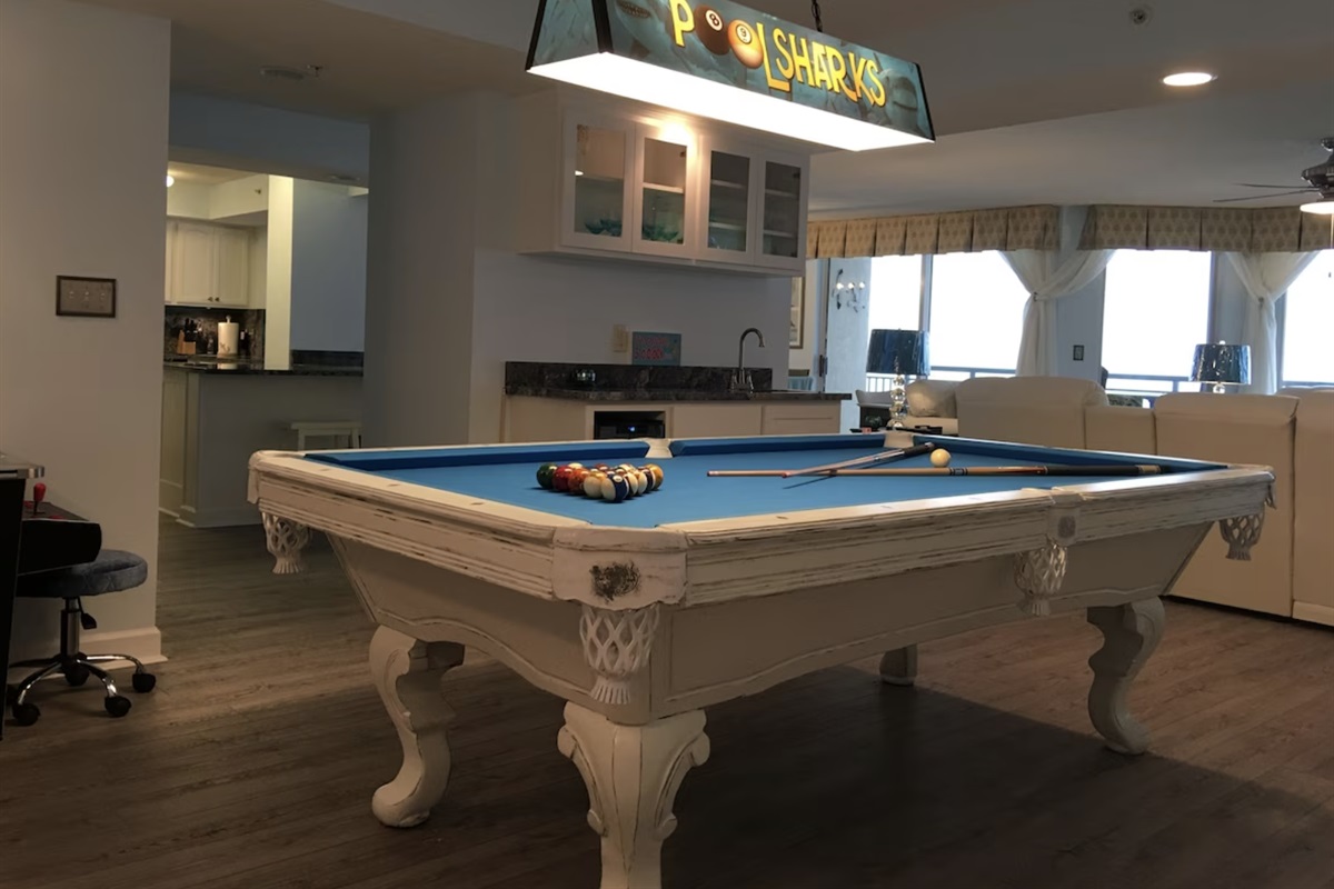 Poolsharks will have a great time making bets at the billiard table!