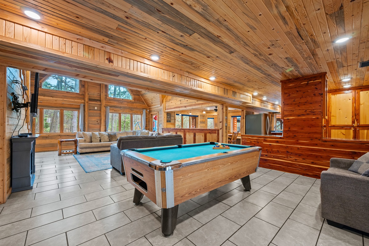 Positioned near the main gathering area, the pool table keeps games and conversation flowing throughout the evening.