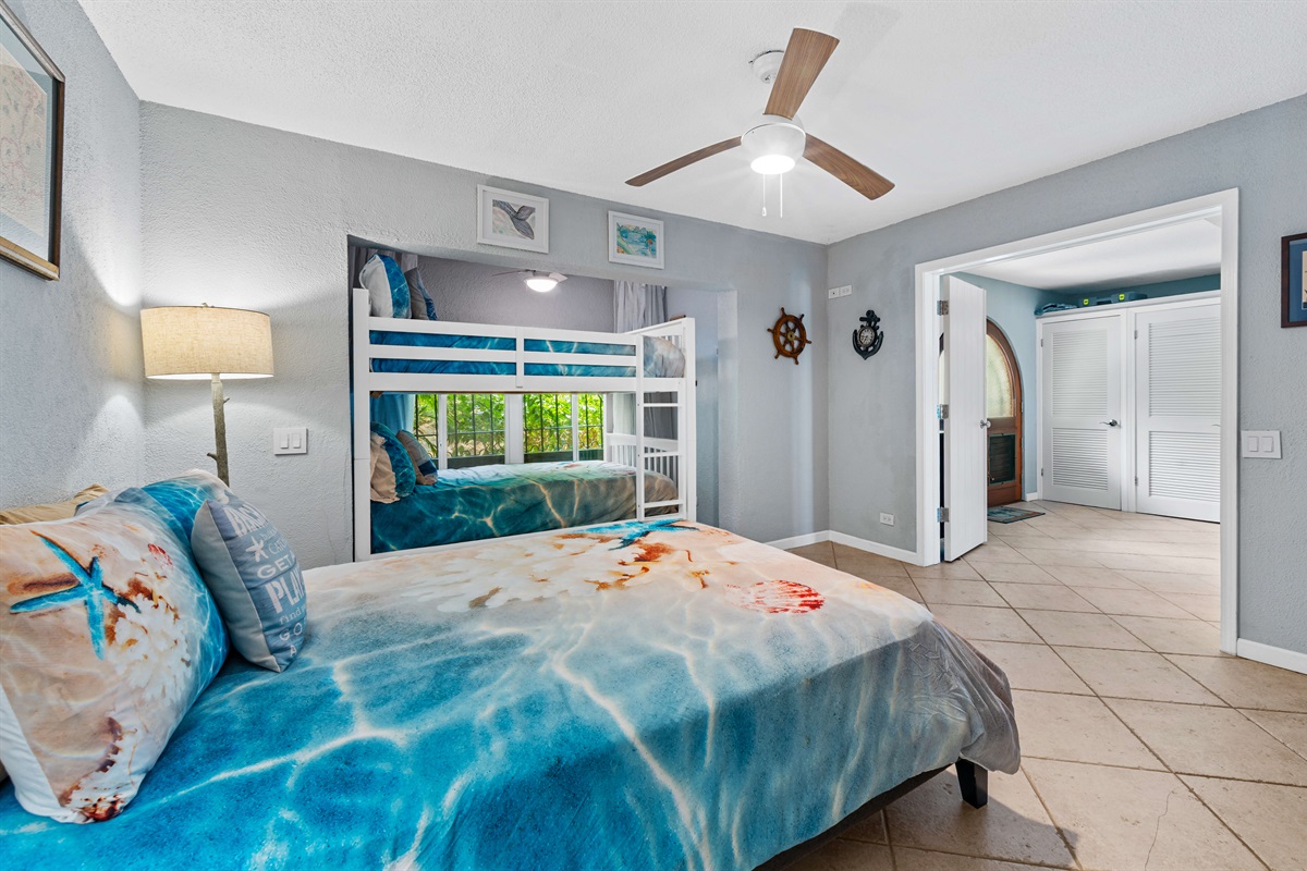 Bright and airy primary bedroom featuring calming hues and resort-style touches.