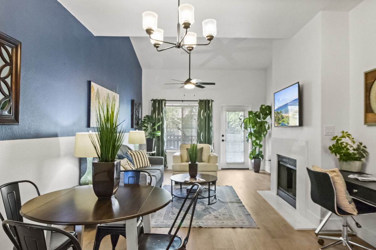 Open living and dining layout with 4 seats. 