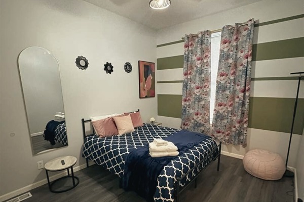 Our bedroom featuring a queen-size bed, the perfect space to relax.