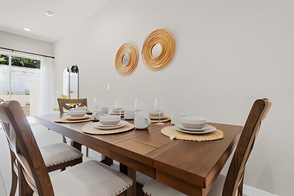 Set the table for unforgettable moments with family and friends in this charming dining area.