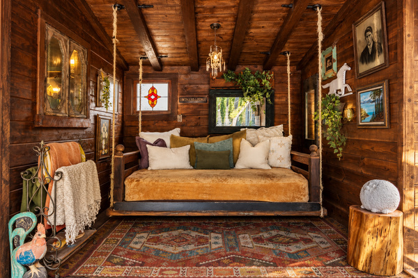 Meet the Bali Bed: a one-of-a-kind swinging daybed tucked into its own wood-paneled, art-filled lounge, made for reading, napping, cocktails or doing absolutely nothing. (AKA: "Swingers Lounge!" ;-) 