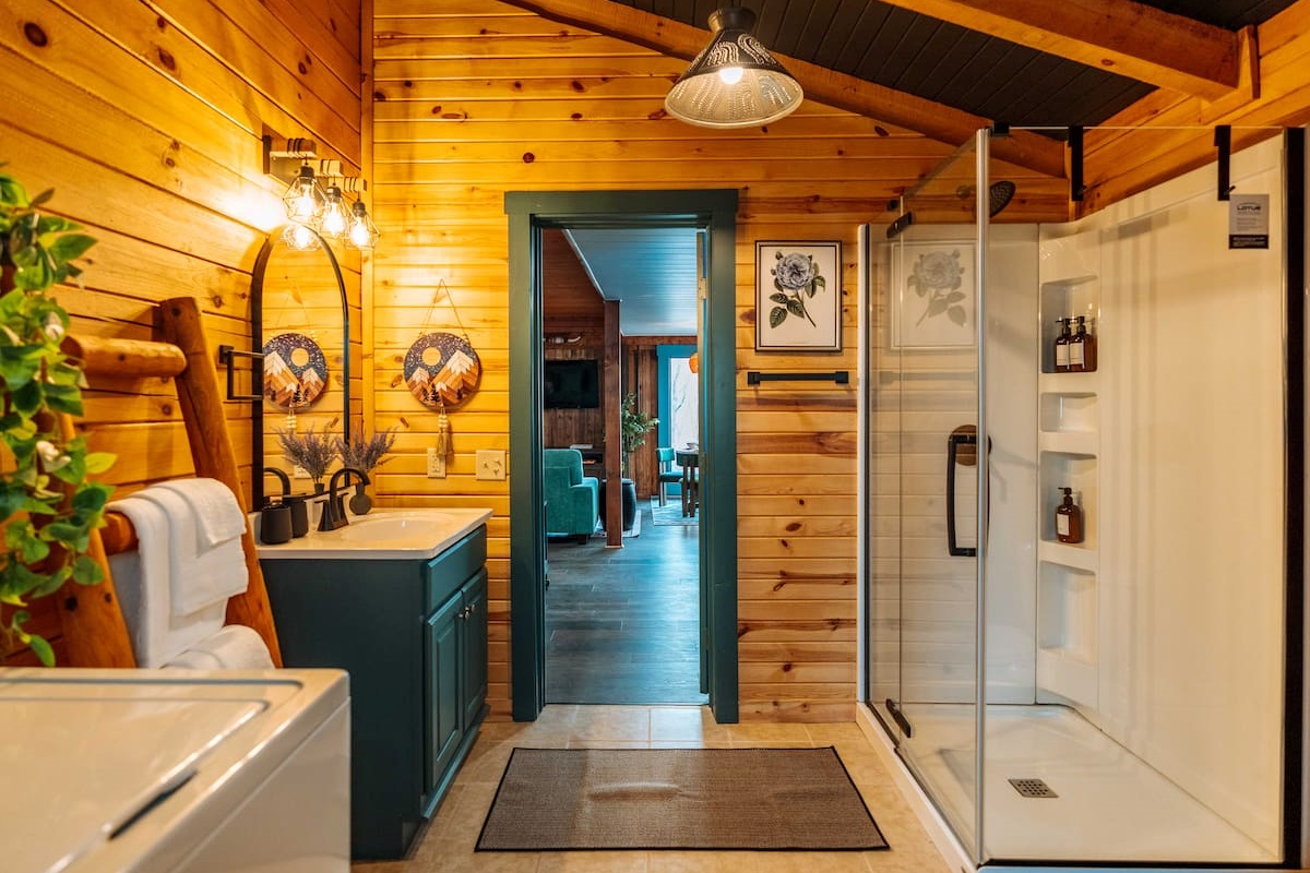 A modern botanical refresh, complete with a glass-enclosed standing shower