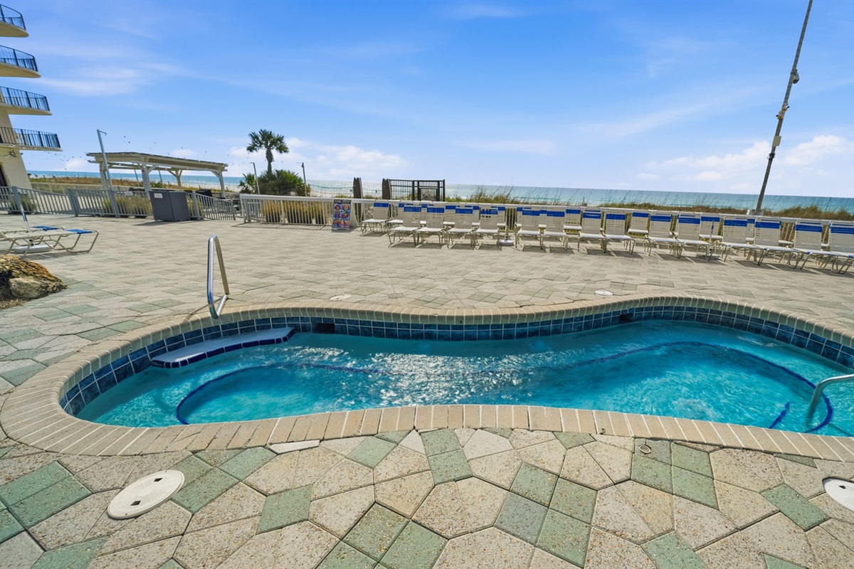 One of four beachfront hot tubs