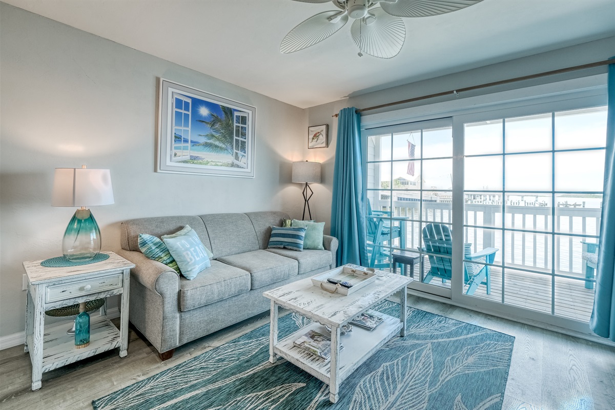 Sliding glass doors lead to porch provide great natural light