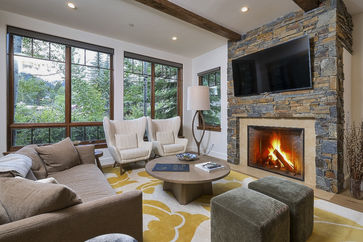 Living Area with Fireplace, TV, River and Mountain Views