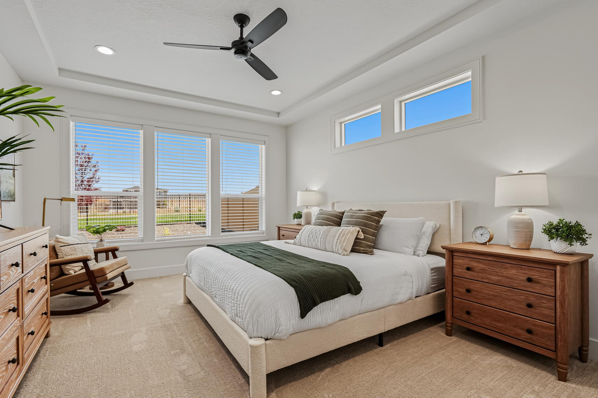 Spacious master bedroom featuring a California King bed, Smart TV, and a relaxing retreat-like atmosphere.