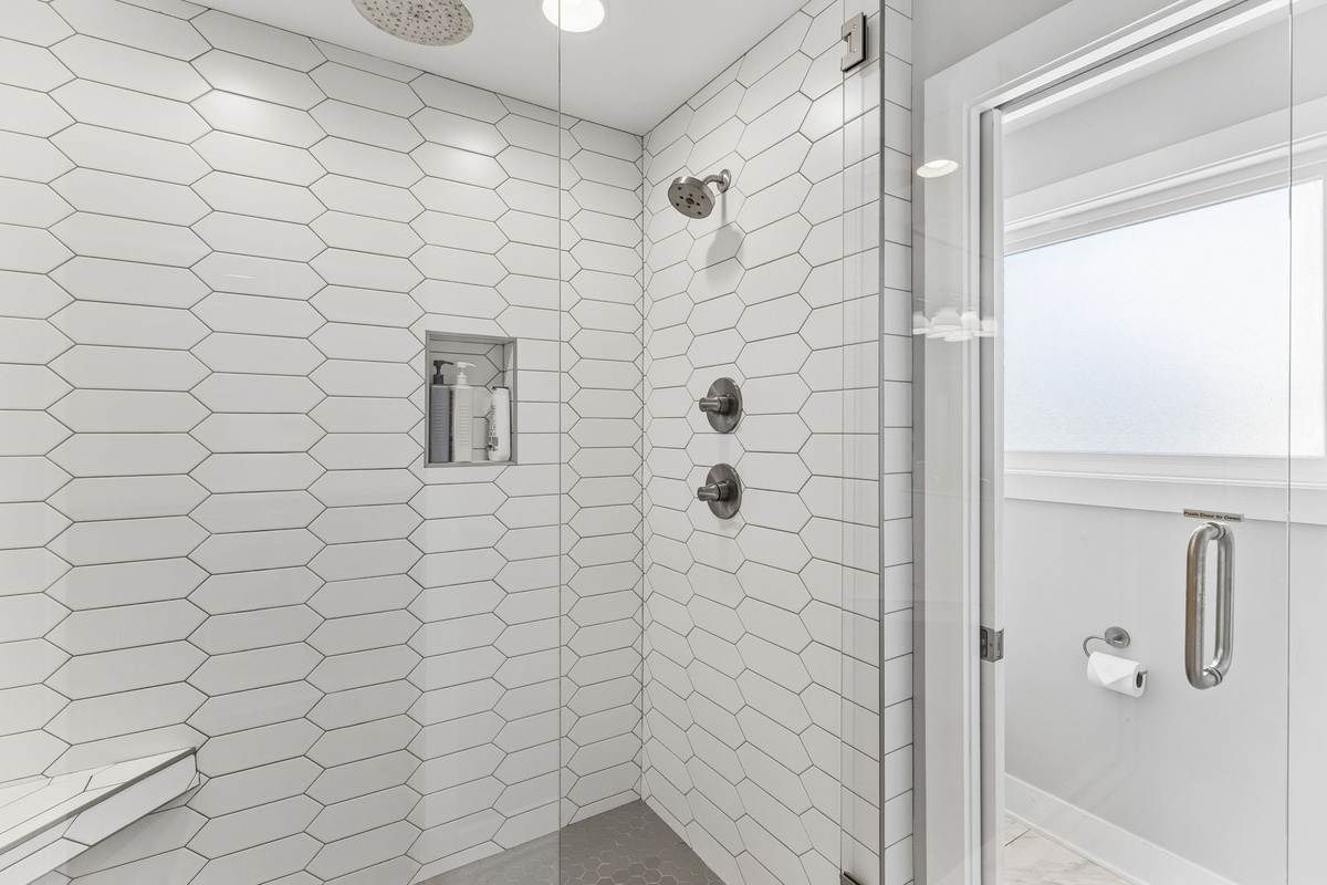 Share the master ensuite without the wait &mdash; double vanity, quartz counters, and enough mirror space so no one's elbowing anyone out of the way.