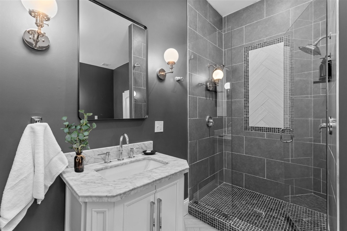 A separate spacious shower provides dual shower heads!  Use your imagination on how to use them!!