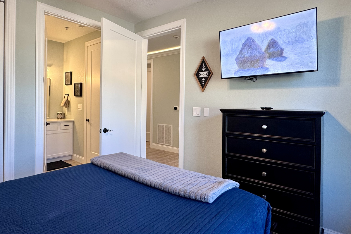 Bedroom 2 has its own private en suite bathroom with a tub-shower combo.
