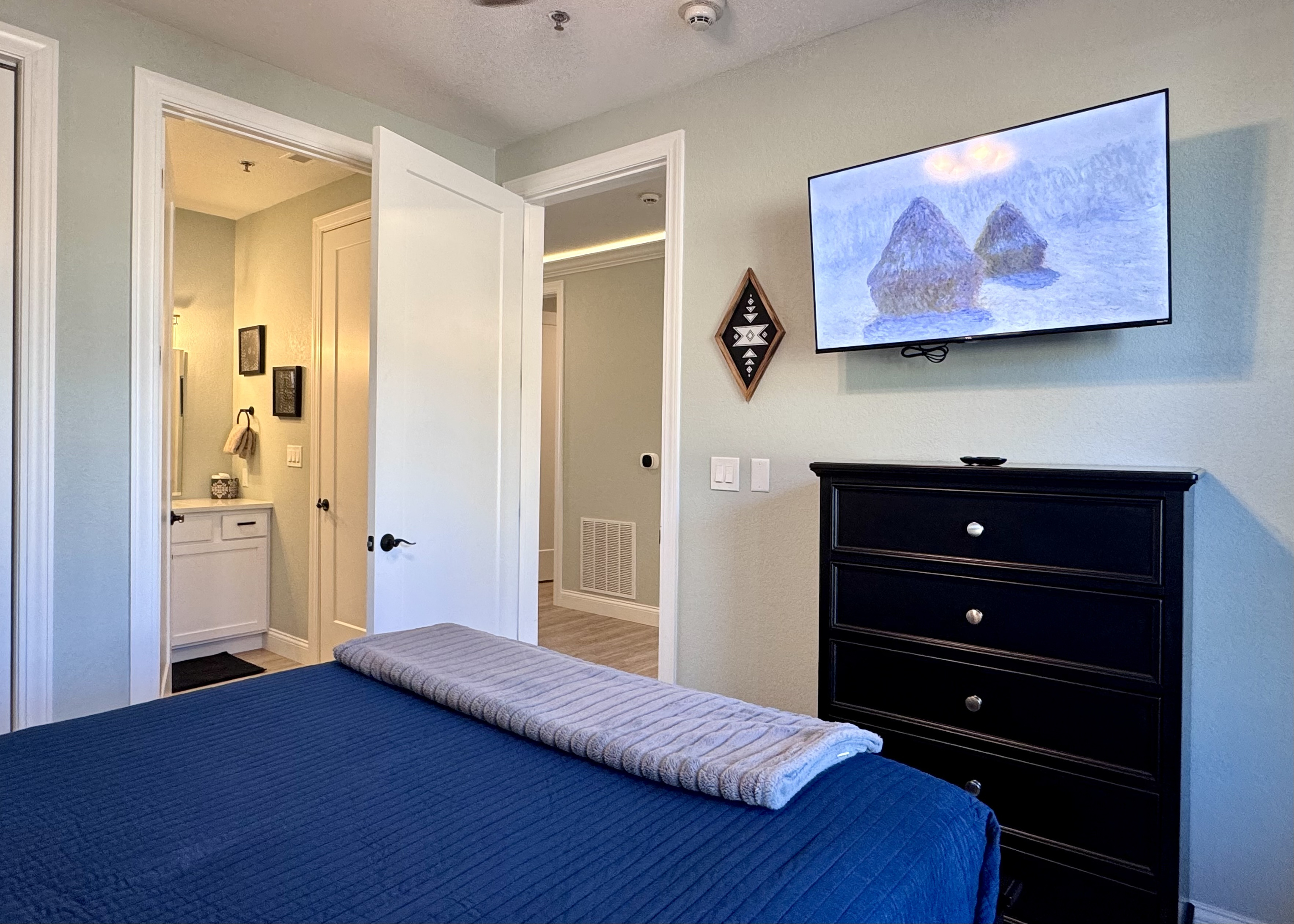 Bedroom 2 has its own private en suite bathroom with a tub-shower combo.
