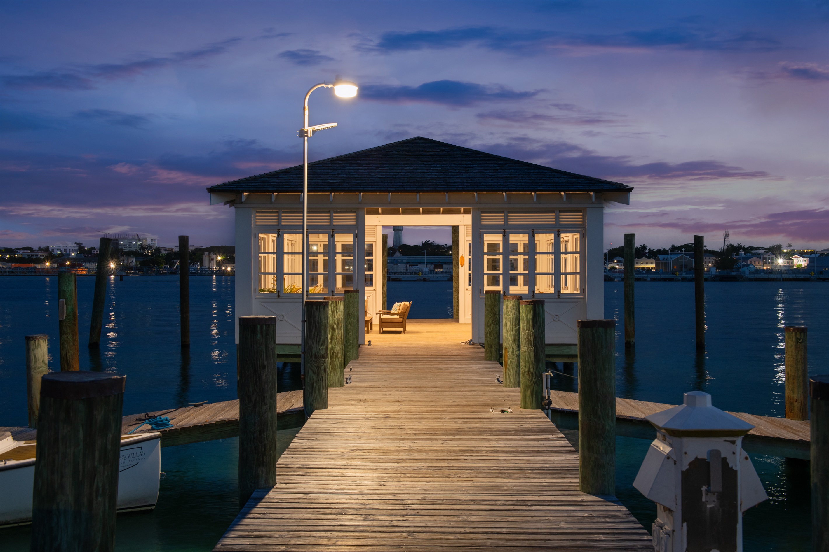 Waterfront seating under the villas private dock house