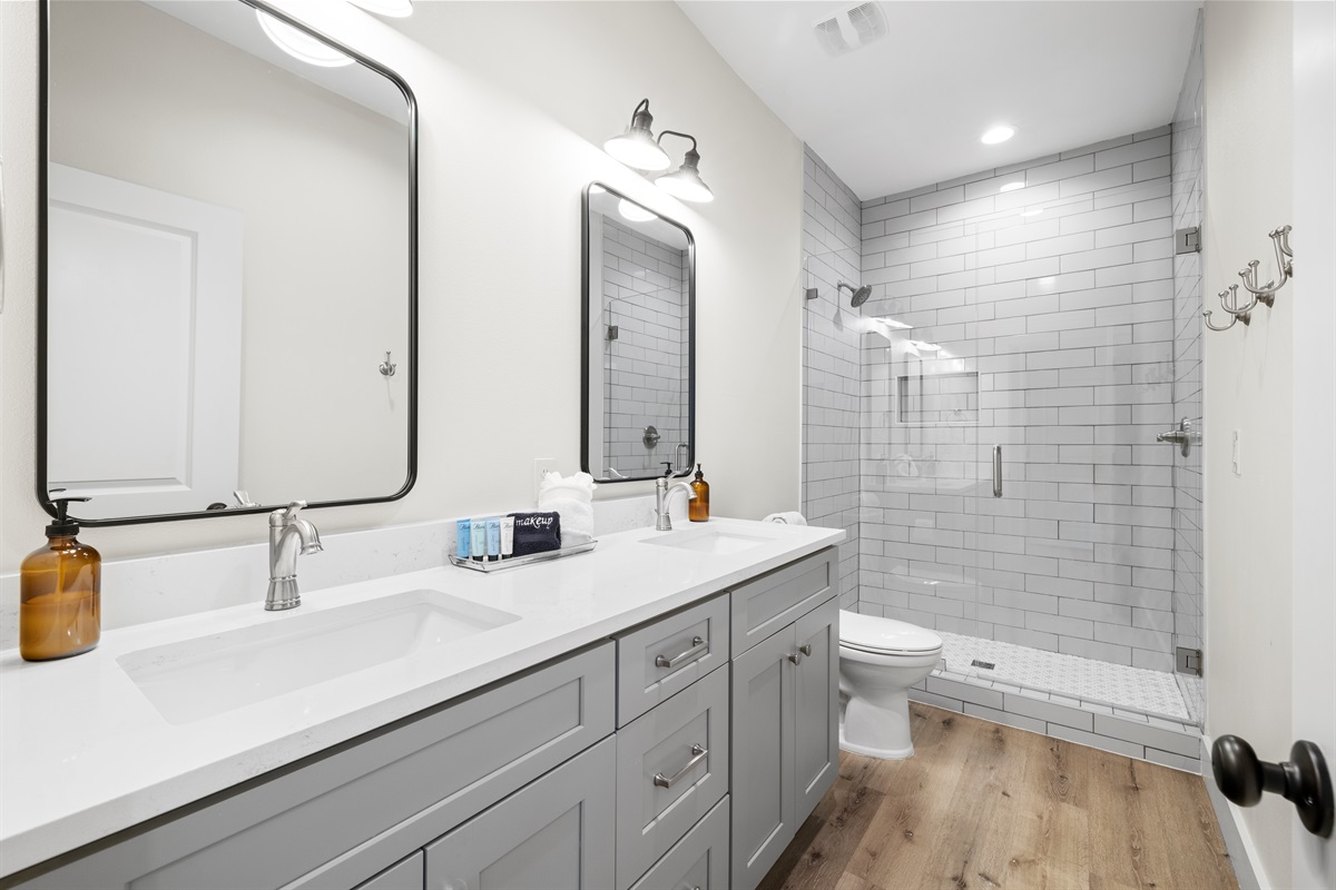 2nd Floor Bunk Ensuite Bathroom has a double vanity and custom walk in shower