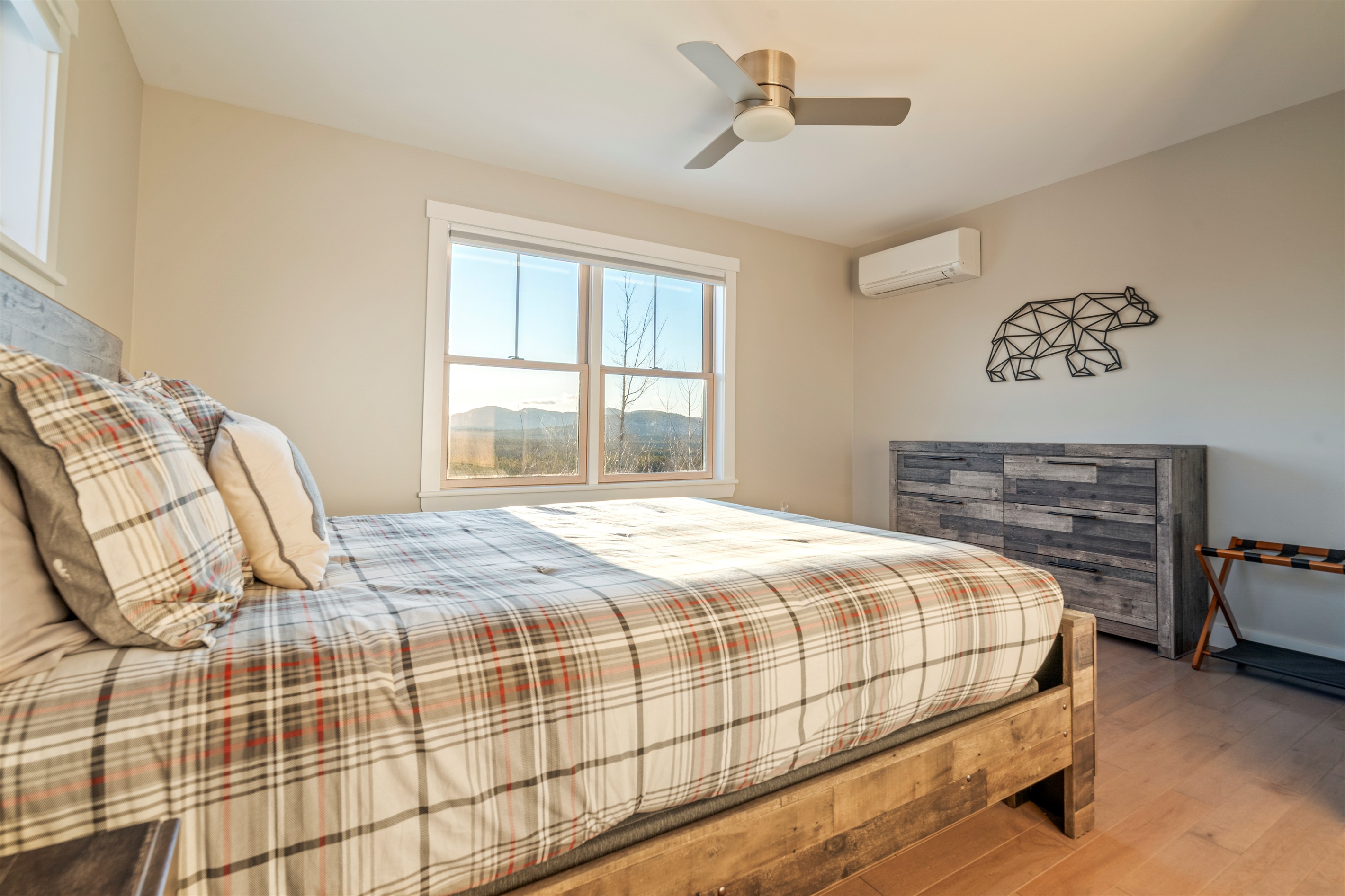Comfortable second-level bedroom with a queen-size bed.