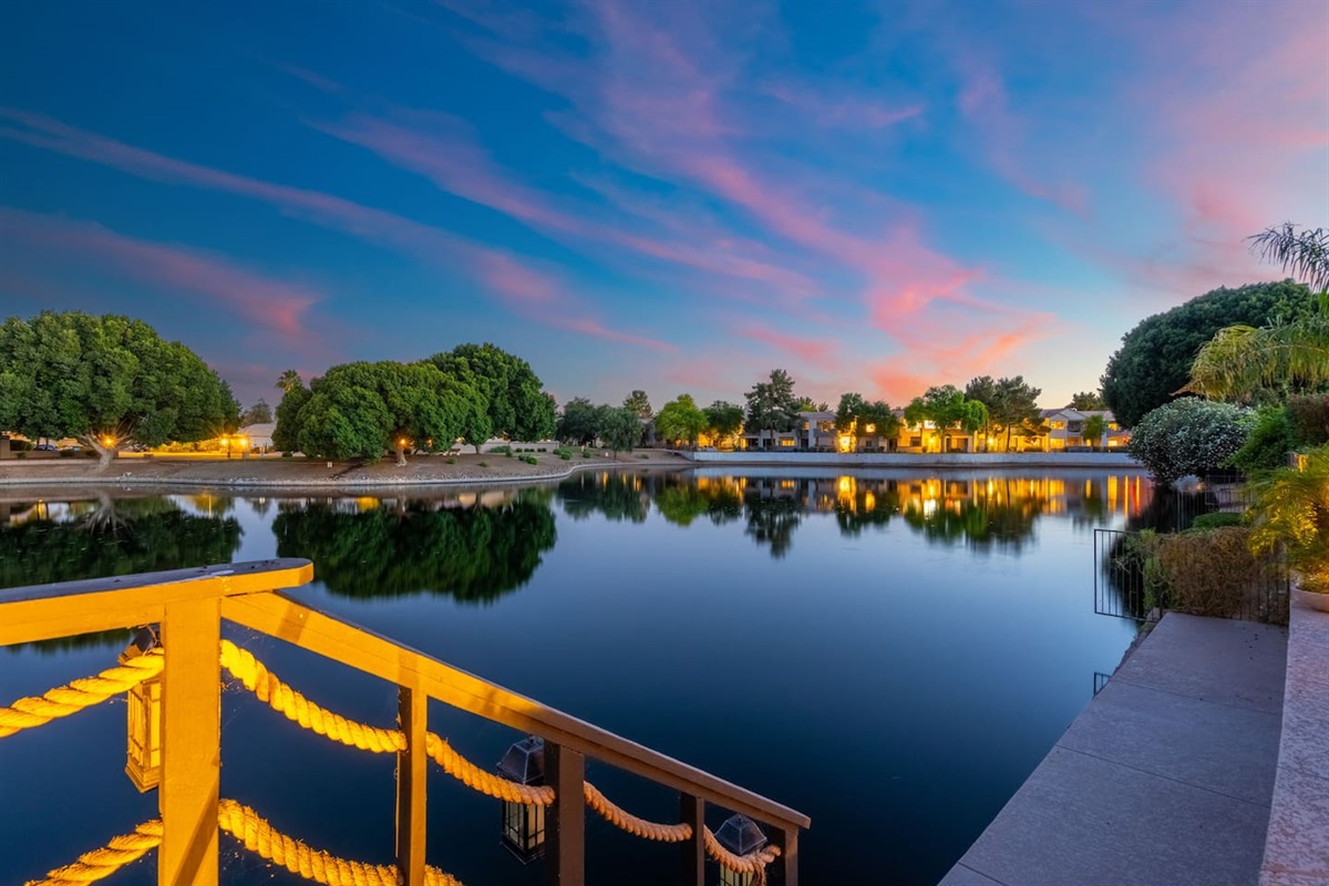 As the lights reflect off the glassy water and the sky fades to deep blue, the dock becomes the most coveted seat in the house — pure Arizona magic.