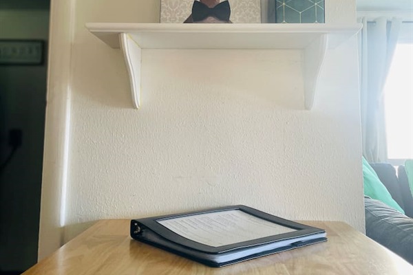 A printed welcome guide is ready on the table, offering helpful information for you and your travel companions.