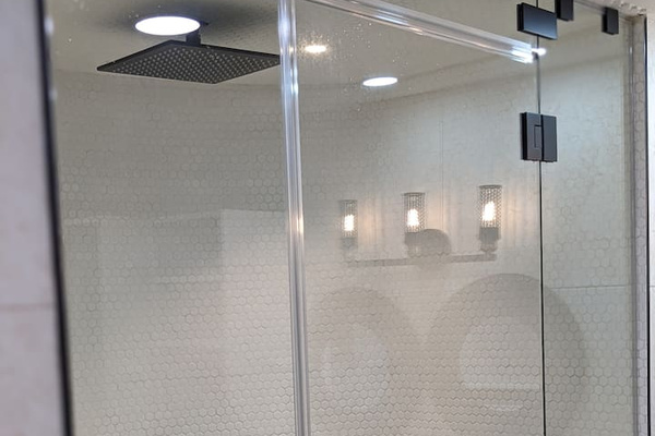 Kind of hard to tell from this pic, but this primary shower has a semi circle shape. This was my idea(Chris) and lets just say Tamara(my wife) thought(thinks) I was crazy:) It works great! 12 inch rainshower head, 4 jets, and steam. Delightfull. 