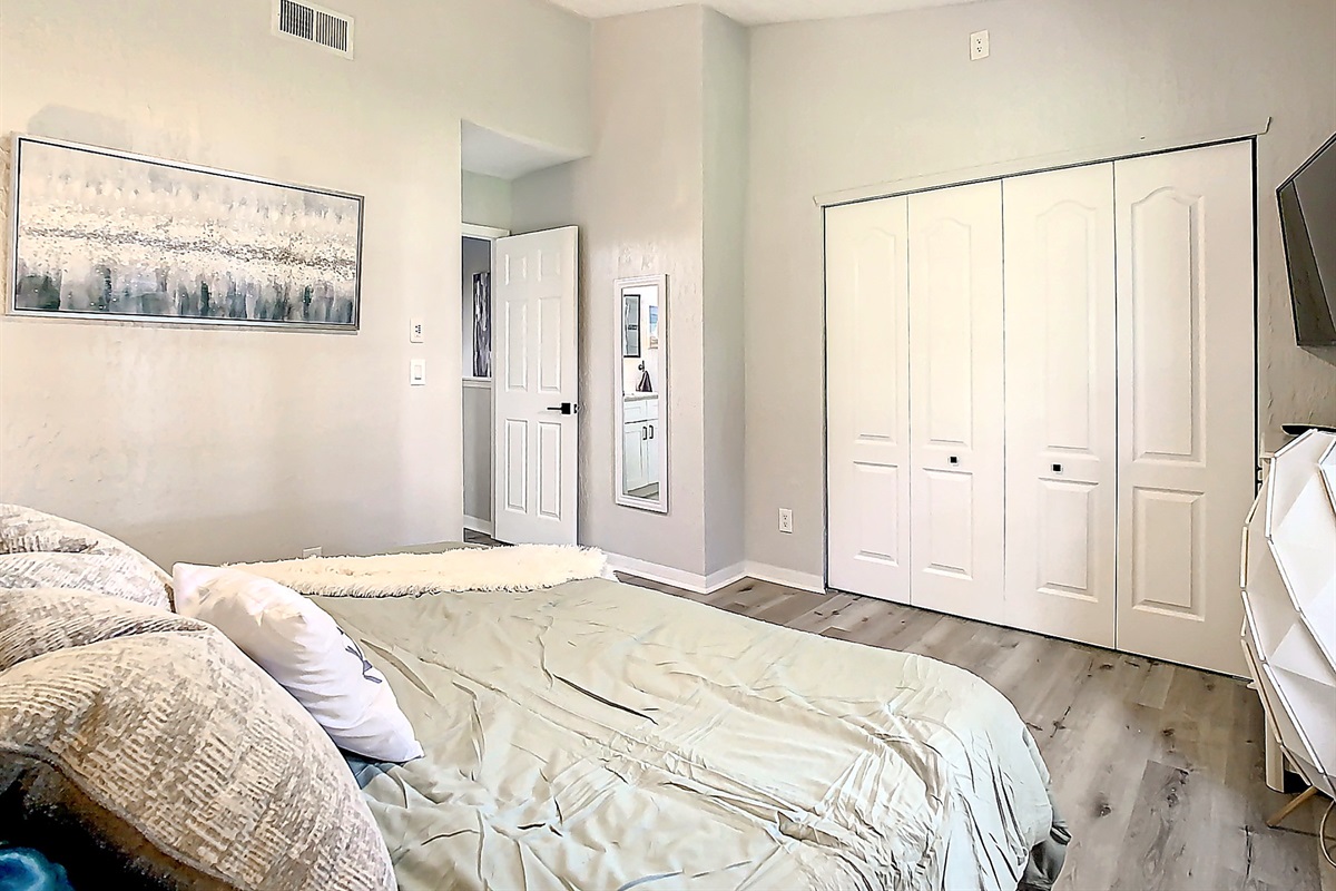 Cozy bedroom with comfortable bed, ample closet space, and peaceful ambiance for ultimate relaxation.