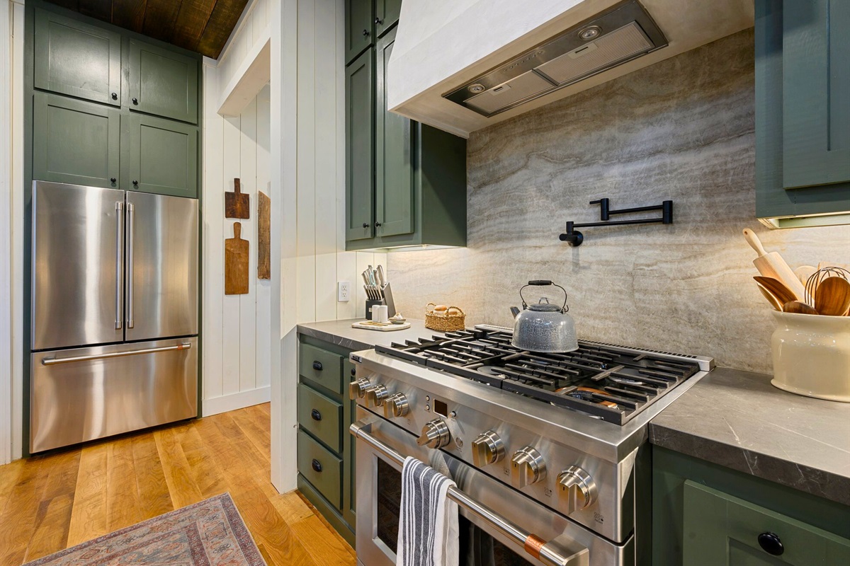 Modern stainless steel appliances and beautiful cabinetry make this kitchen as functional as it is stylish.