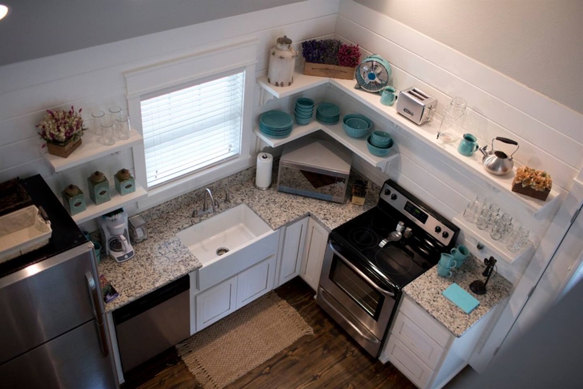 Unique arkansas cottage rental with open shelving farmhouse kitchen