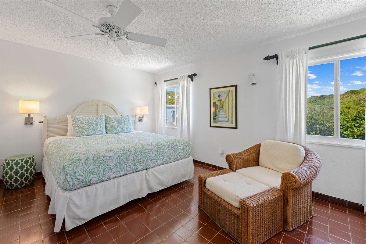At the end of the hallway off the kitchen is the first bedroom with a king bed.