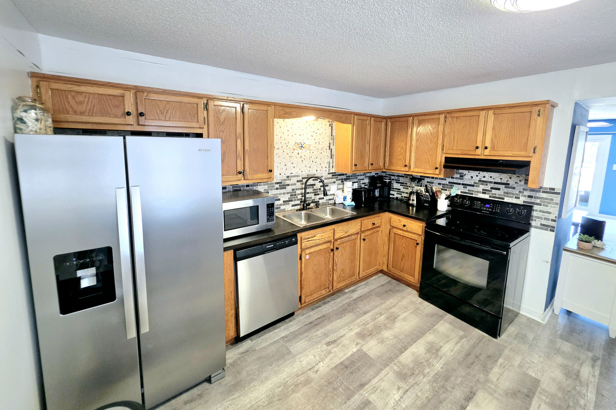 Kitchen with tile backsplash and plenty of cabinet space