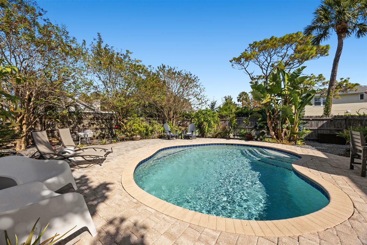 Sparkling Pool with Sun Loungers
A beautifully maintained pool surrounded by multiple lounge chairs and lush greenery. Ideal for sunbathing, swimming, and enjoying warm Florida days.