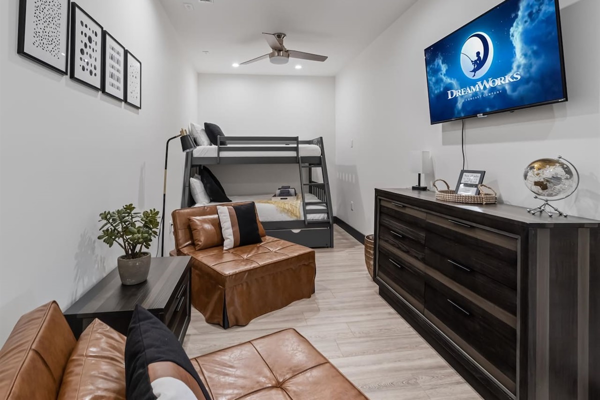 Bedroom with twin over full bunk and trundle with two sleeper chairs that make king or two twin beds