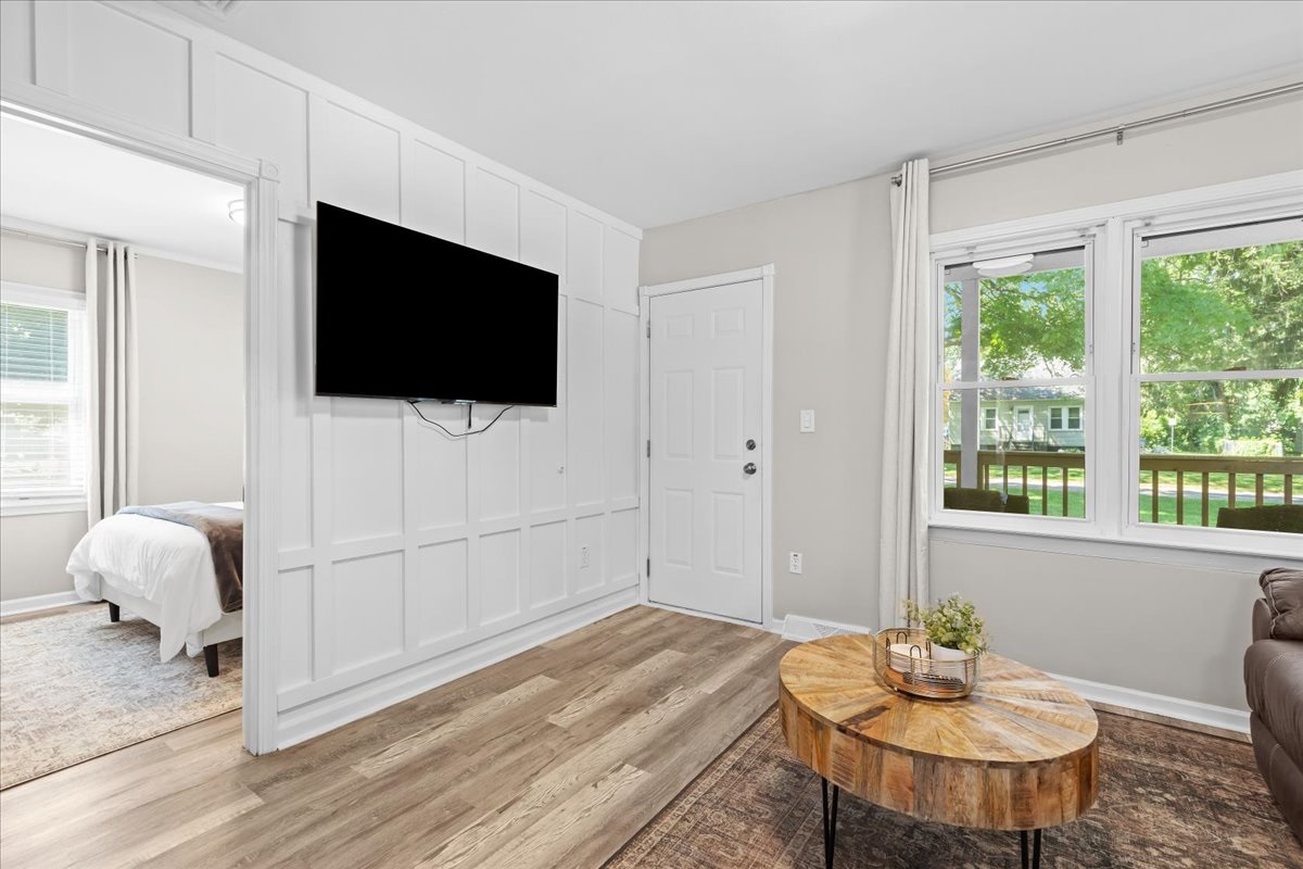 Open living space with wall-mounted TV and clean design