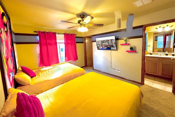 Spacious double queen bedroom with an ensuite bath for comfort and privacy.