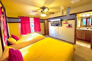 Spacious double queen bedroom with an ensuite bath for comfort and privacy.