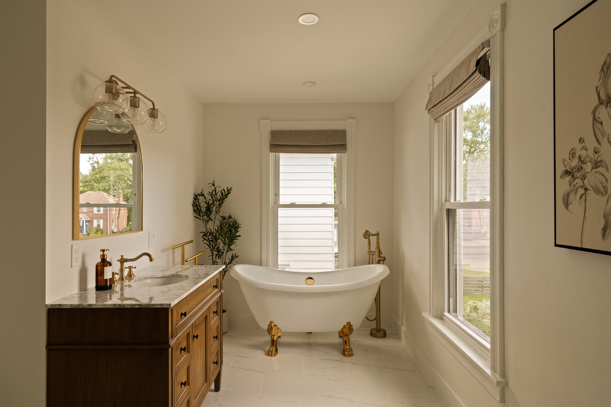 Soak, slow down, and stay awhile. This light-filled bathroom pairs a beautiful clawfoot tub with modern comforts and timeless character.
