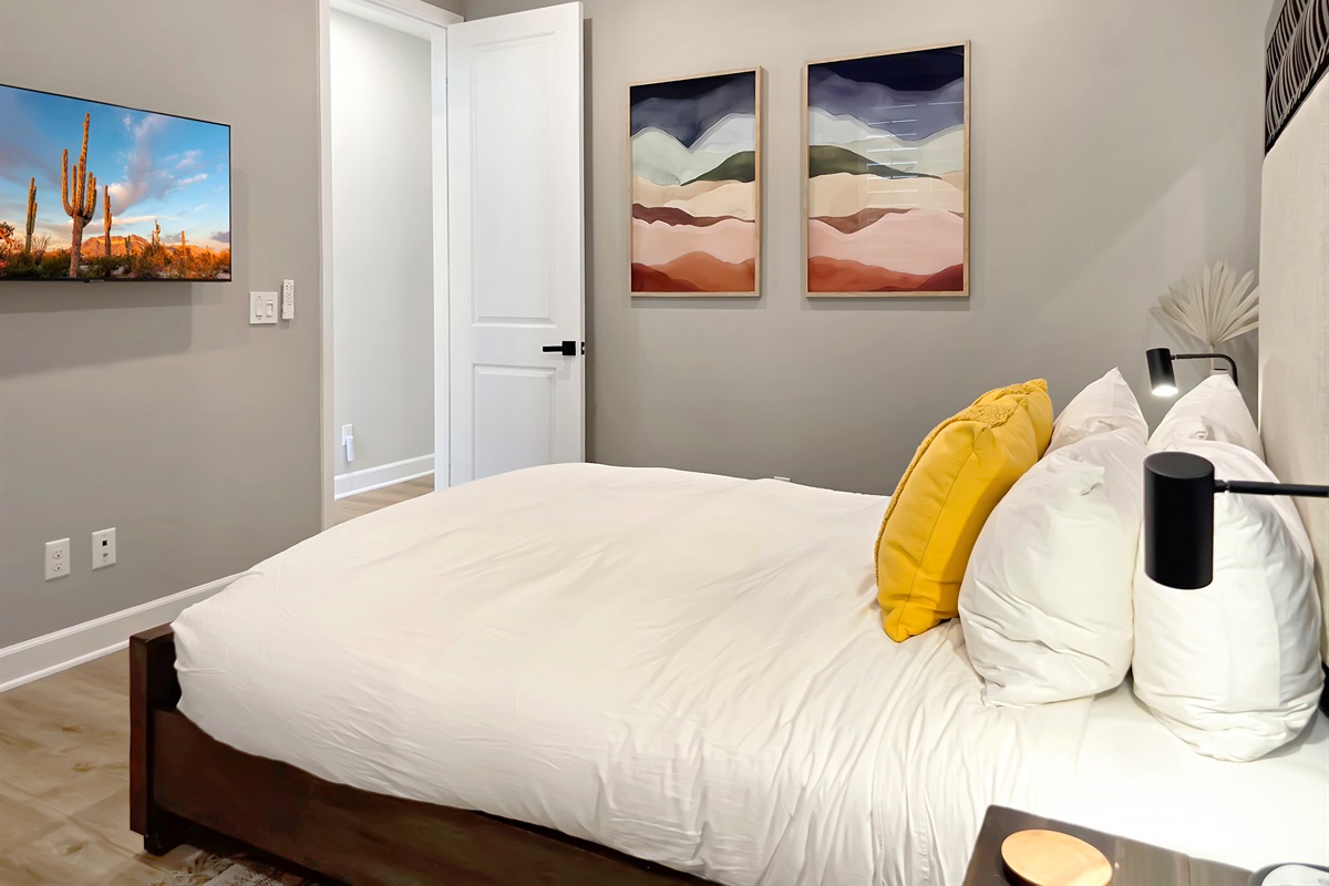 First-floor primary suite features a queen bed and smart HDTV.