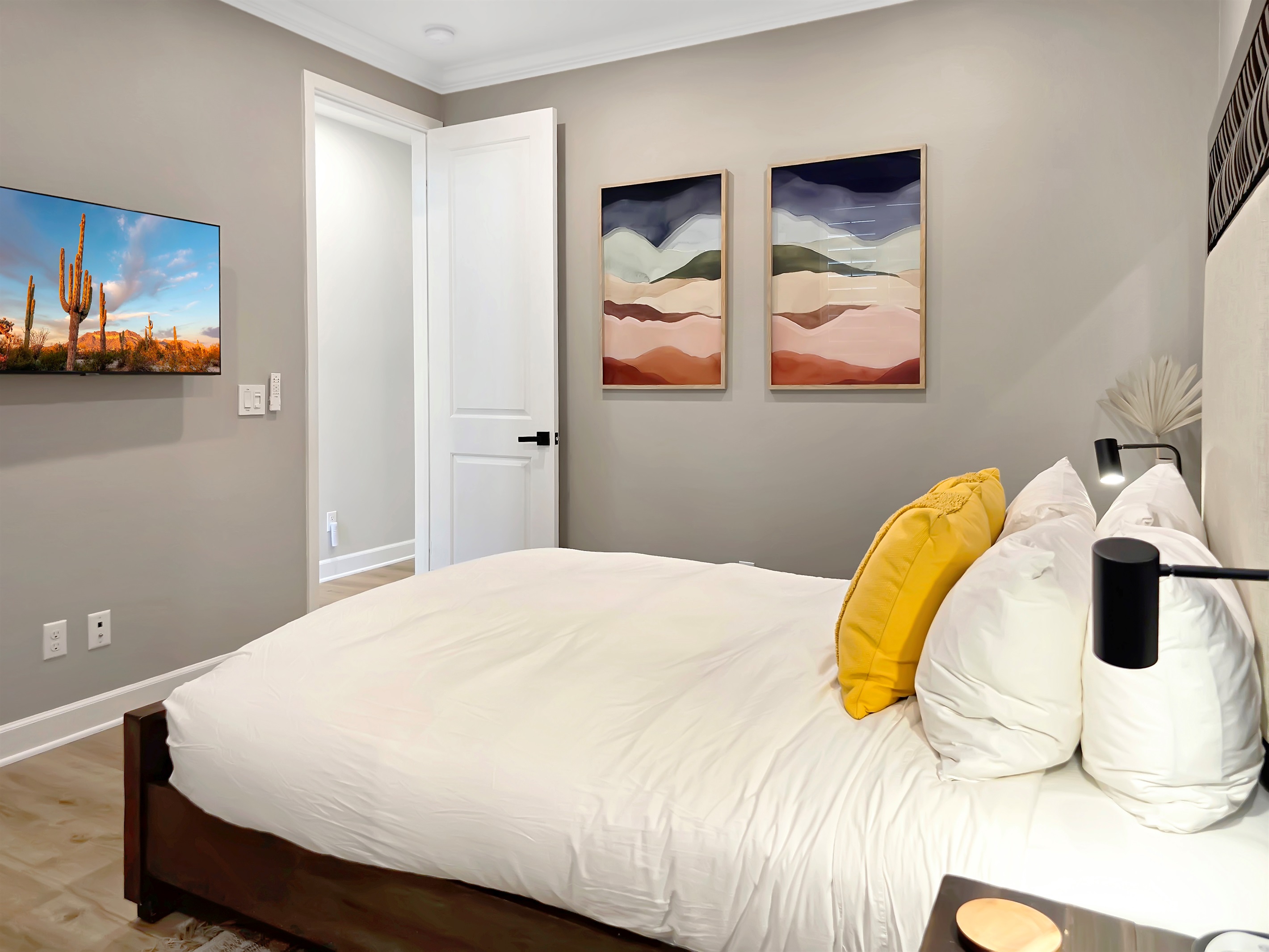 First-floor primary suite features a queen bed and smart HDTV.