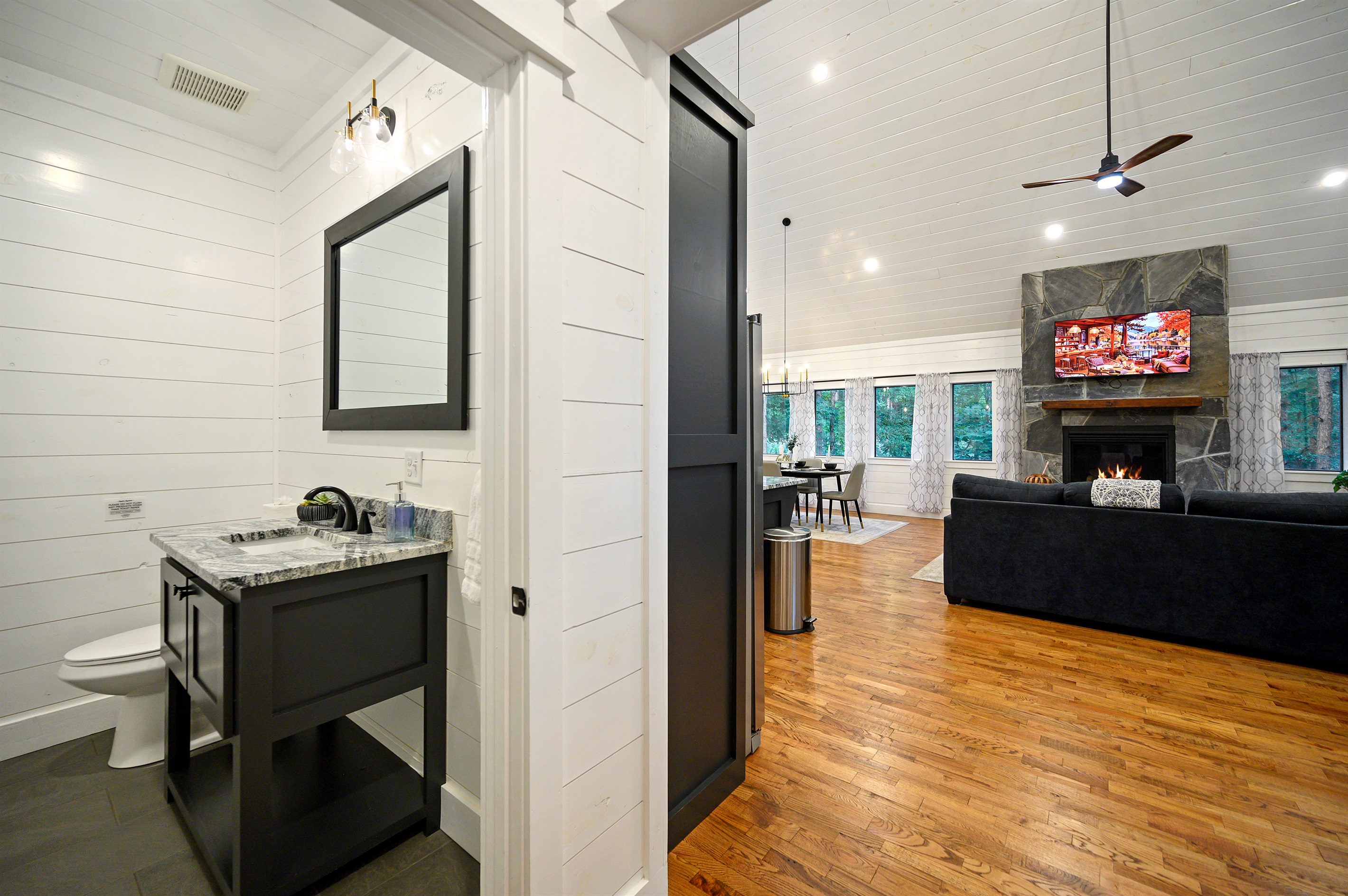Your half bath is a completely separate space from your Main Bathroom.  It's perfect for quick refreshes and guest use. With a sleek vanity and bright lighting, it adds style, privacy, and convenience to your stay.
