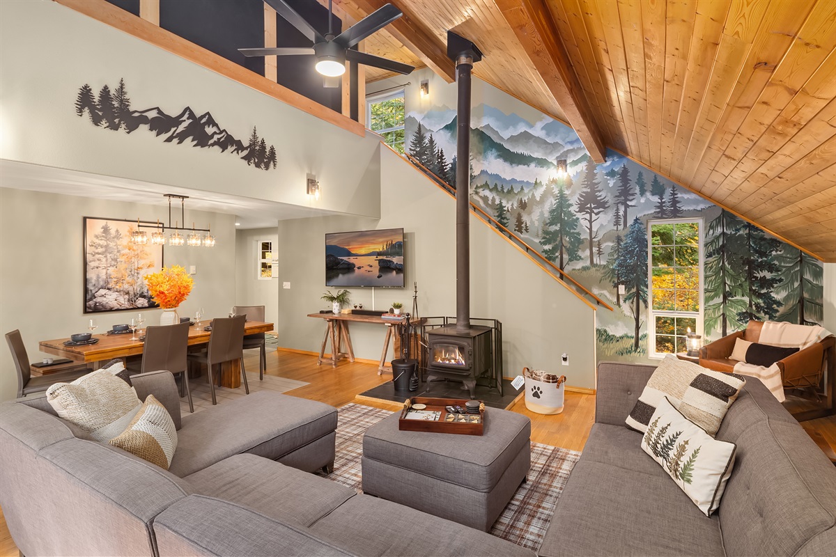 Open living room and dining room with wood burning stove